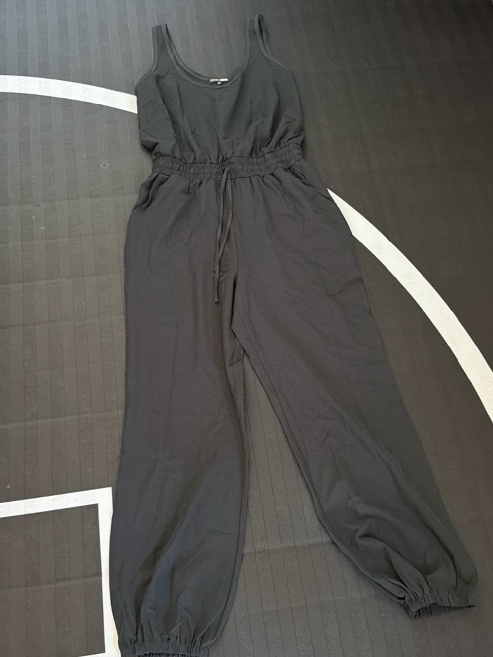 Fashion Nova Black Sleeveless Drawstring Jumpsuit with Elastic Cuffs